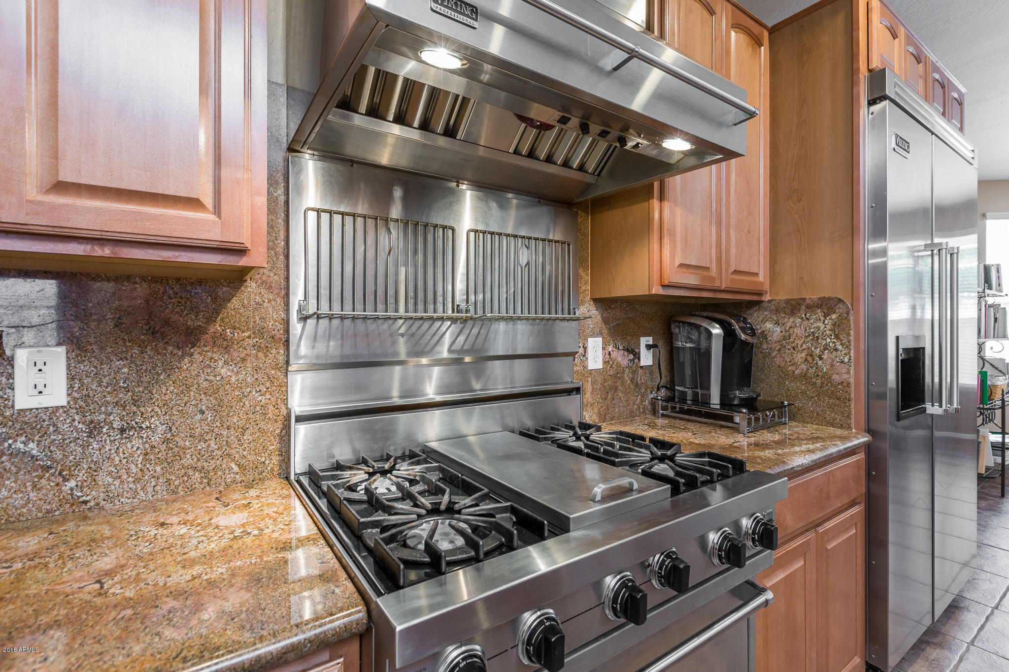 3744 East Del Rio Street Gilbert, AZ 85295 - Photo 10 of 32 a stove top oven sitting inside of a kitchen