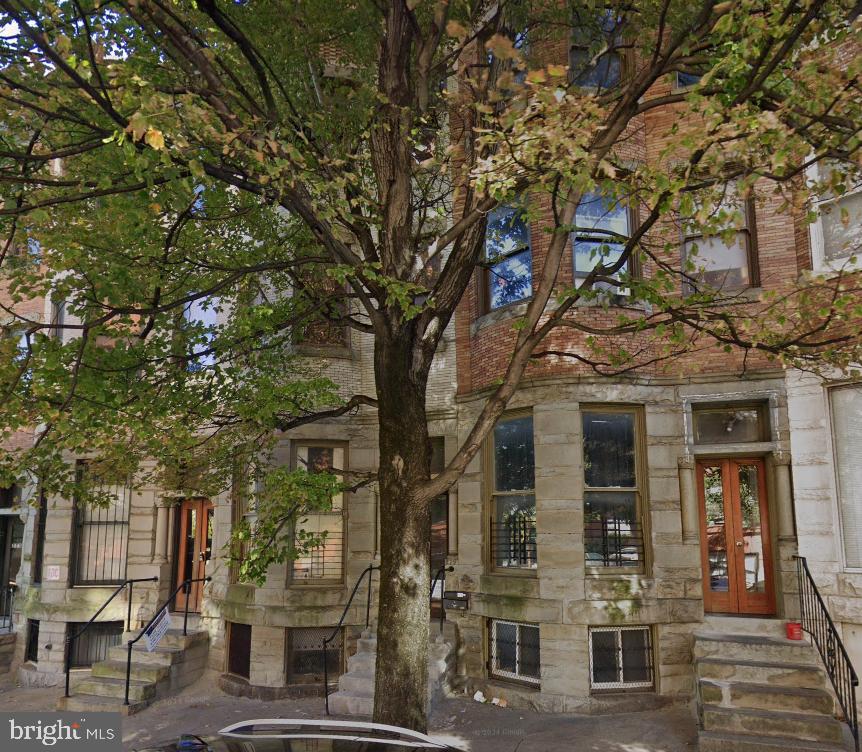 a view of a building with a tree