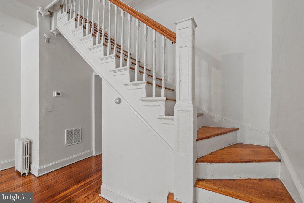 217 East Preston Street Baltimore, MD 21202 - Photo 13 of 60 a view of entryway and hall with wooden floor