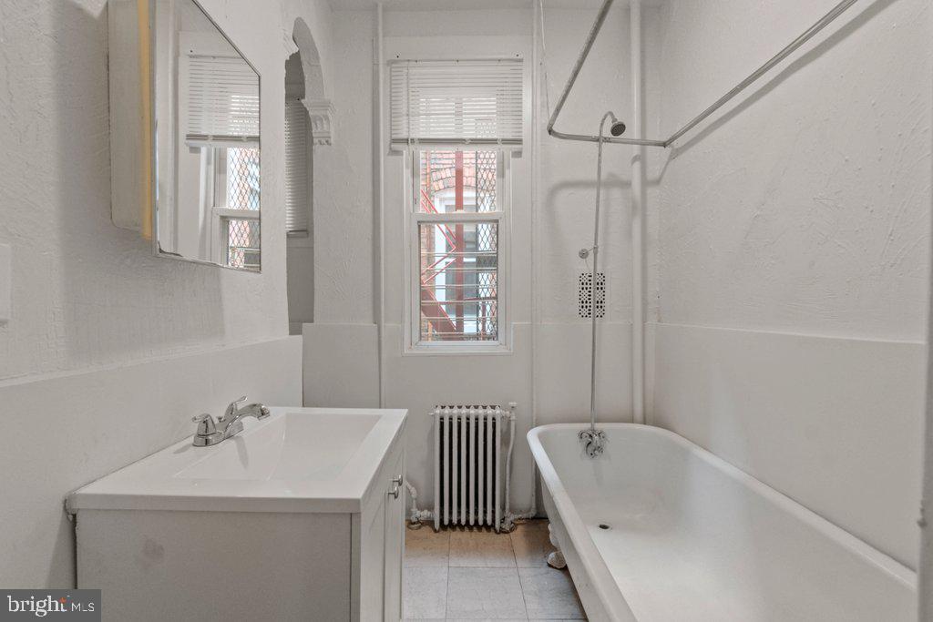 217 East Preston Street Baltimore, MD 21202 - Photo 17 of 60 a bathroom with a sink a toilet and shower