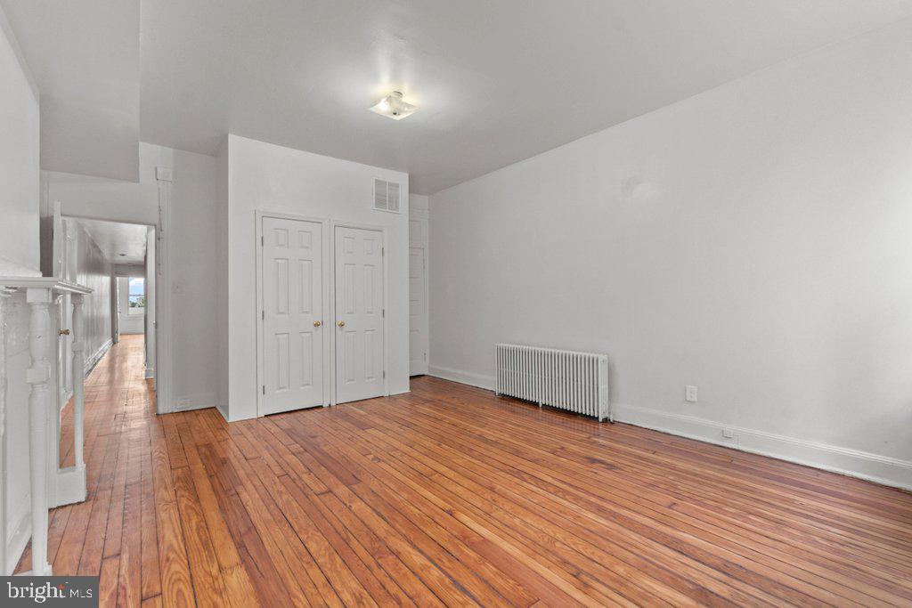 217 East Preston Street Baltimore, MD 21202 - Photo 19 of 60 a view of empty room with wooden floor
