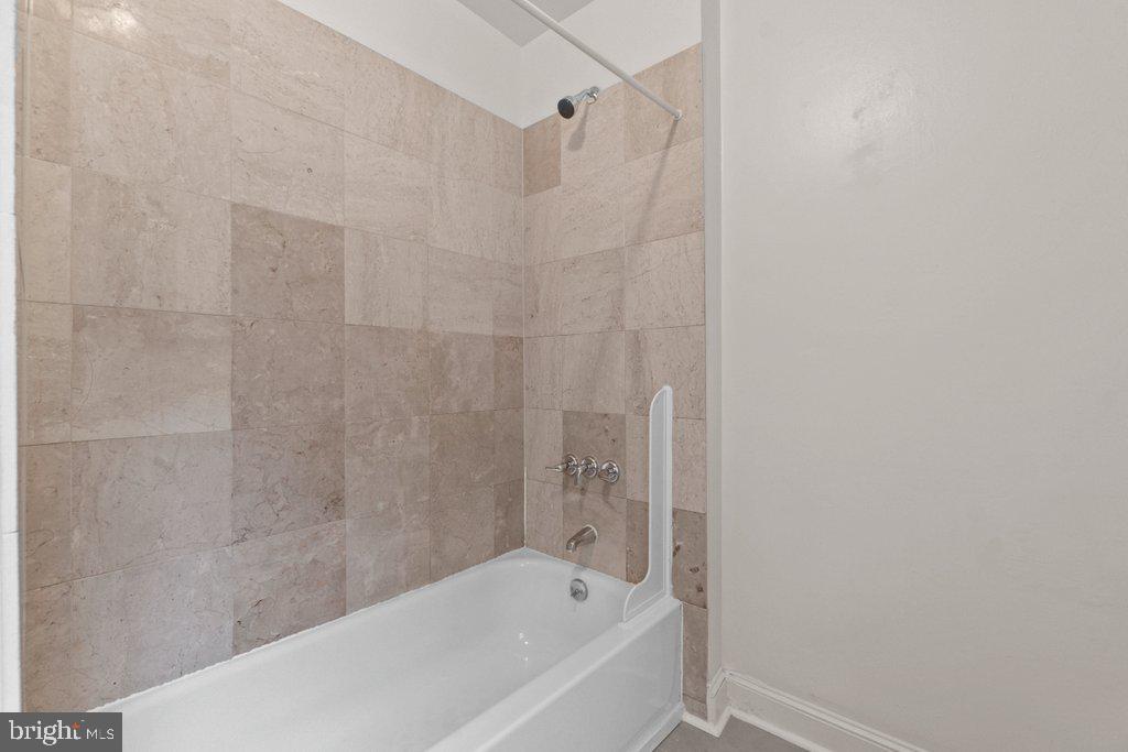 217 East Preston Street Baltimore, MD 21202 - Photo 22 of 60 a bathroom with a bathtub and a shower