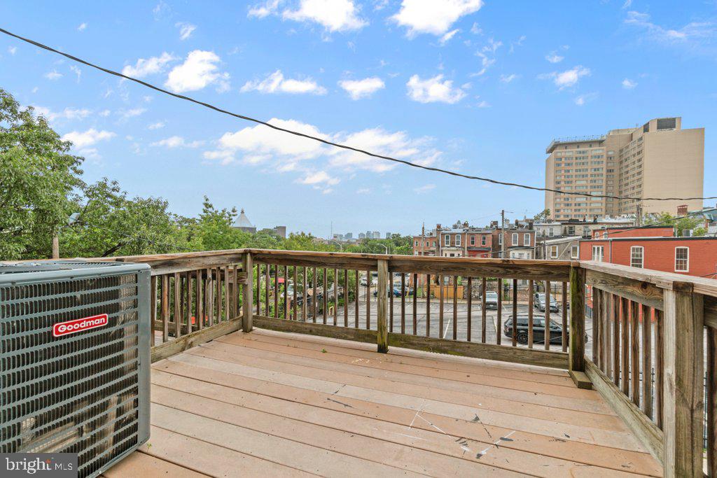 217 East Preston Street Baltimore, MD 21202 - Photo 24 of 60 a view of a balcony with wooden floor