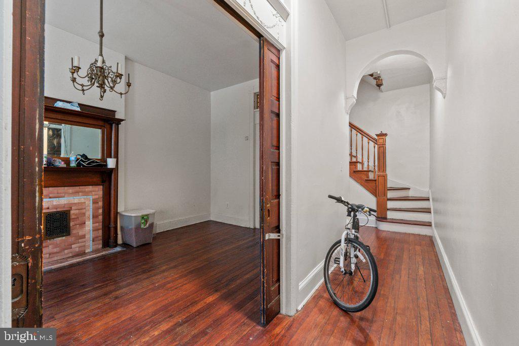 217 East Preston Street Baltimore, MD 21202 - Photo 25 of 60 a view of a livingroom with wooden floor and staircase
