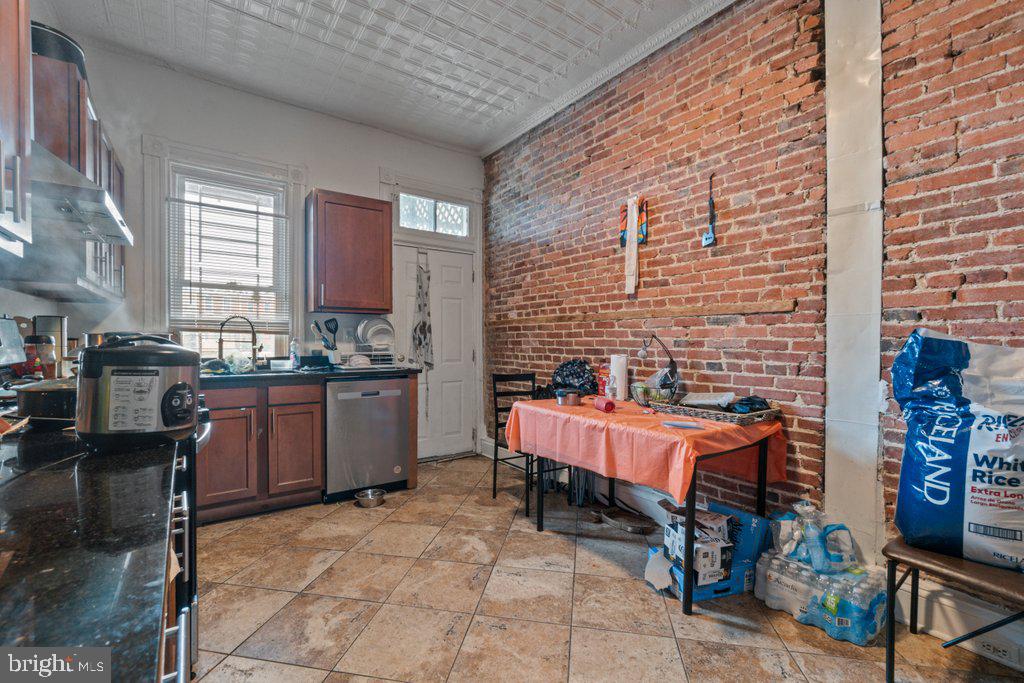 217 East Preston Street Baltimore, MD 21202 - Photo 29 of 60 a kitchen filled with a table and chairs