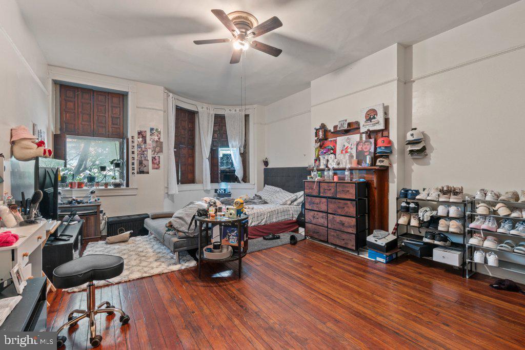 217 East Preston Street Baltimore, MD 21202 - Photo 31 of 60 a living room with furniture and wooden floor