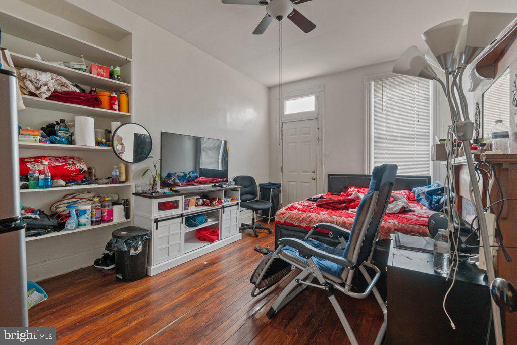 217 East Preston Street Baltimore, MD 21202 - Photo 33 of 60 a living room with furniture and a wooden floor