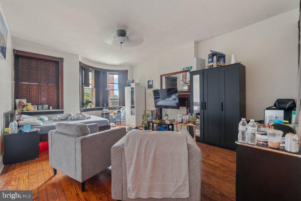 217 East Preston Street Baltimore, MD 21202 - Photo 34 of 60 a living room with furniture and a flat screen tv