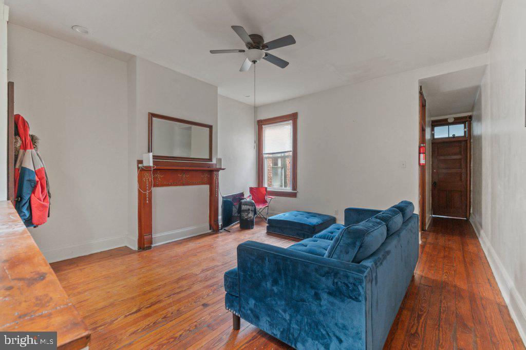 217 East Preston Street Baltimore, MD 21202 - Photo 35 of 60 a living room with furniture and a wooden floor