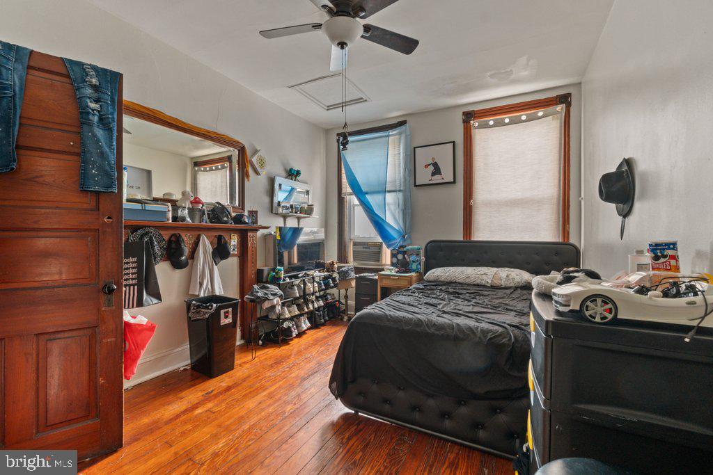 217 East Preston Street Baltimore, MD 21202 - Photo 36 of 60 a bedroom with bed and a chandelier