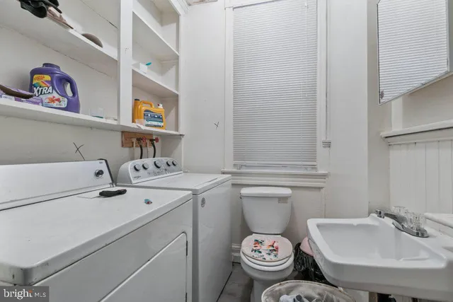 a kitchen with a refrigerator and a sink