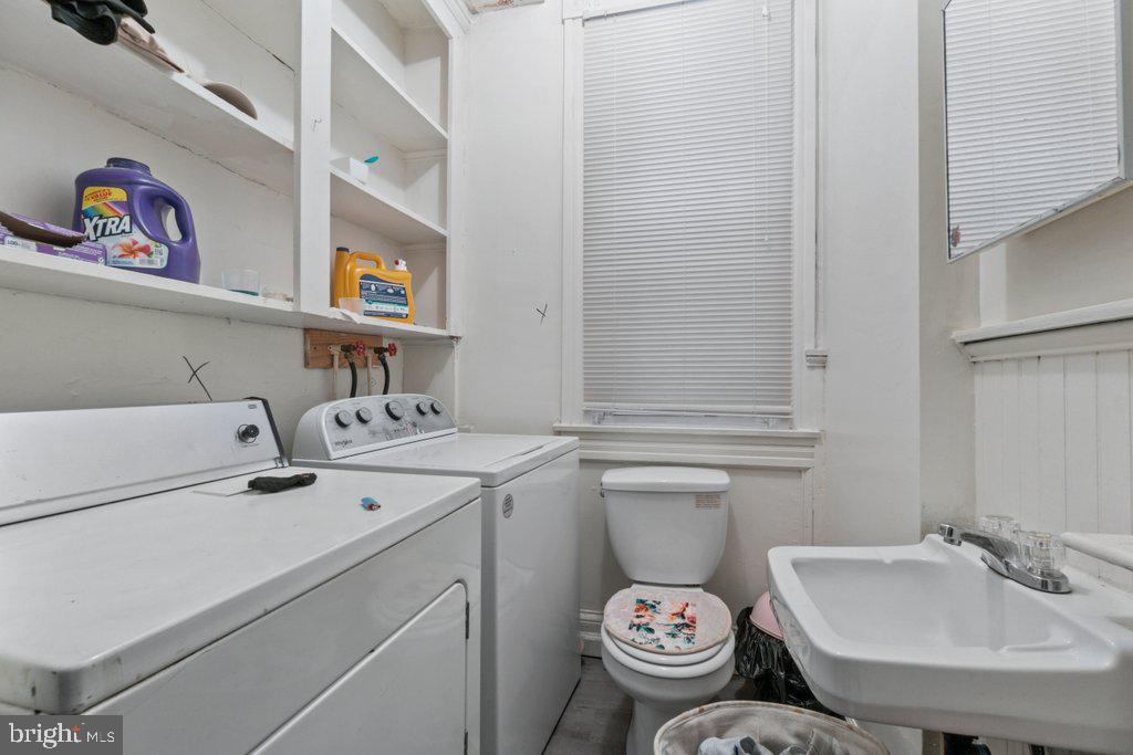 217 East Preston Street Baltimore, MD 21202 - Photo 38 of 60 a bathroom with a sink and a toilet