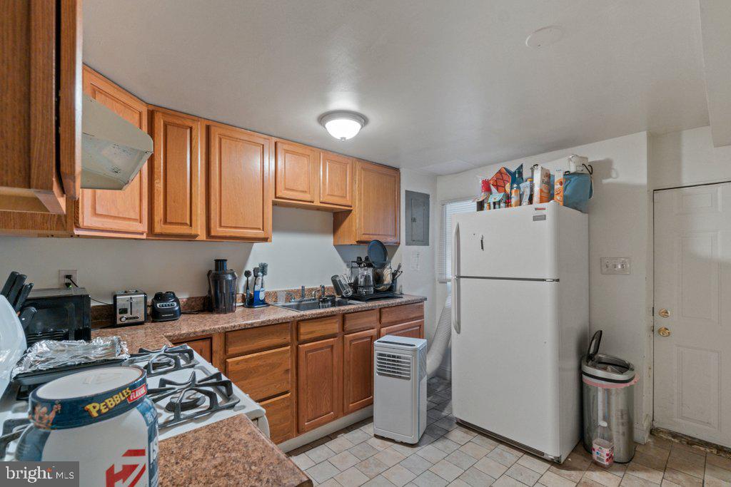 217 East Preston Street Baltimore, MD 21202 - Photo 42 of 60 a kitchen with a refrigerator and a sink
