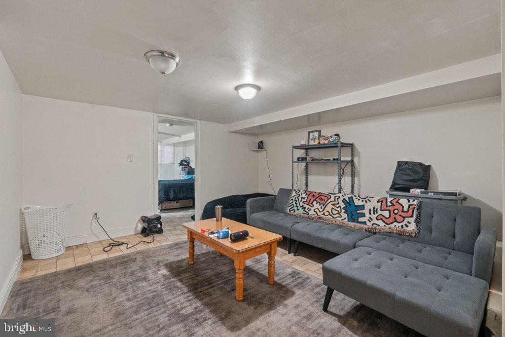 217 East Preston Street Baltimore, MD 21202 - Photo 44 of 60 a living room with furniture and a wooden floor
