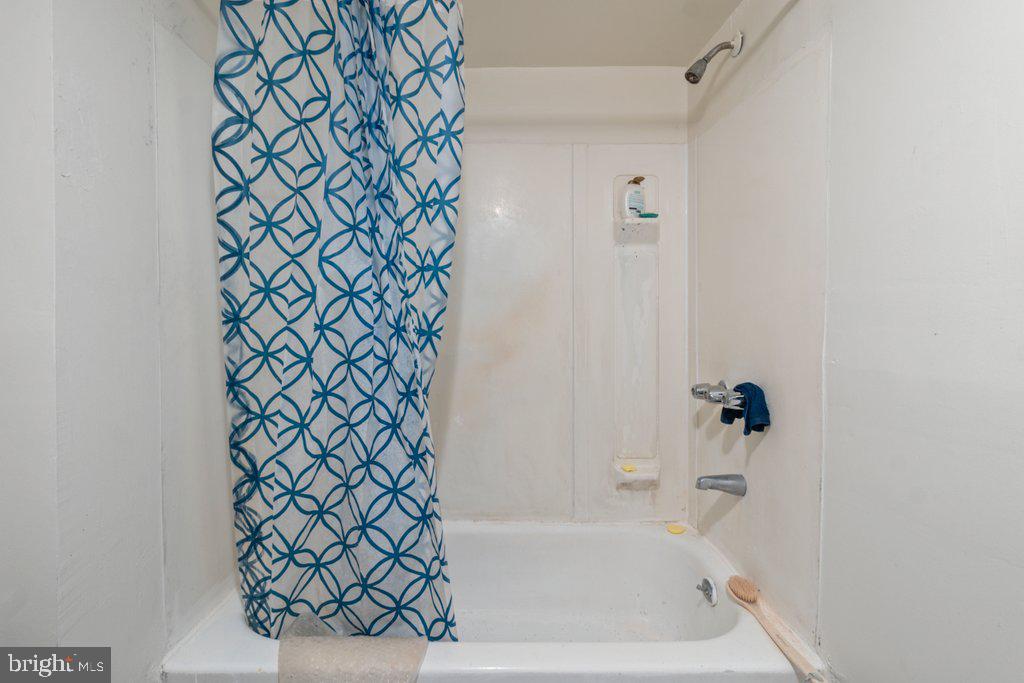 217 East Preston Street Baltimore, MD 21202 - Photo 50 of 60 a bathroom with a bathtub and shower