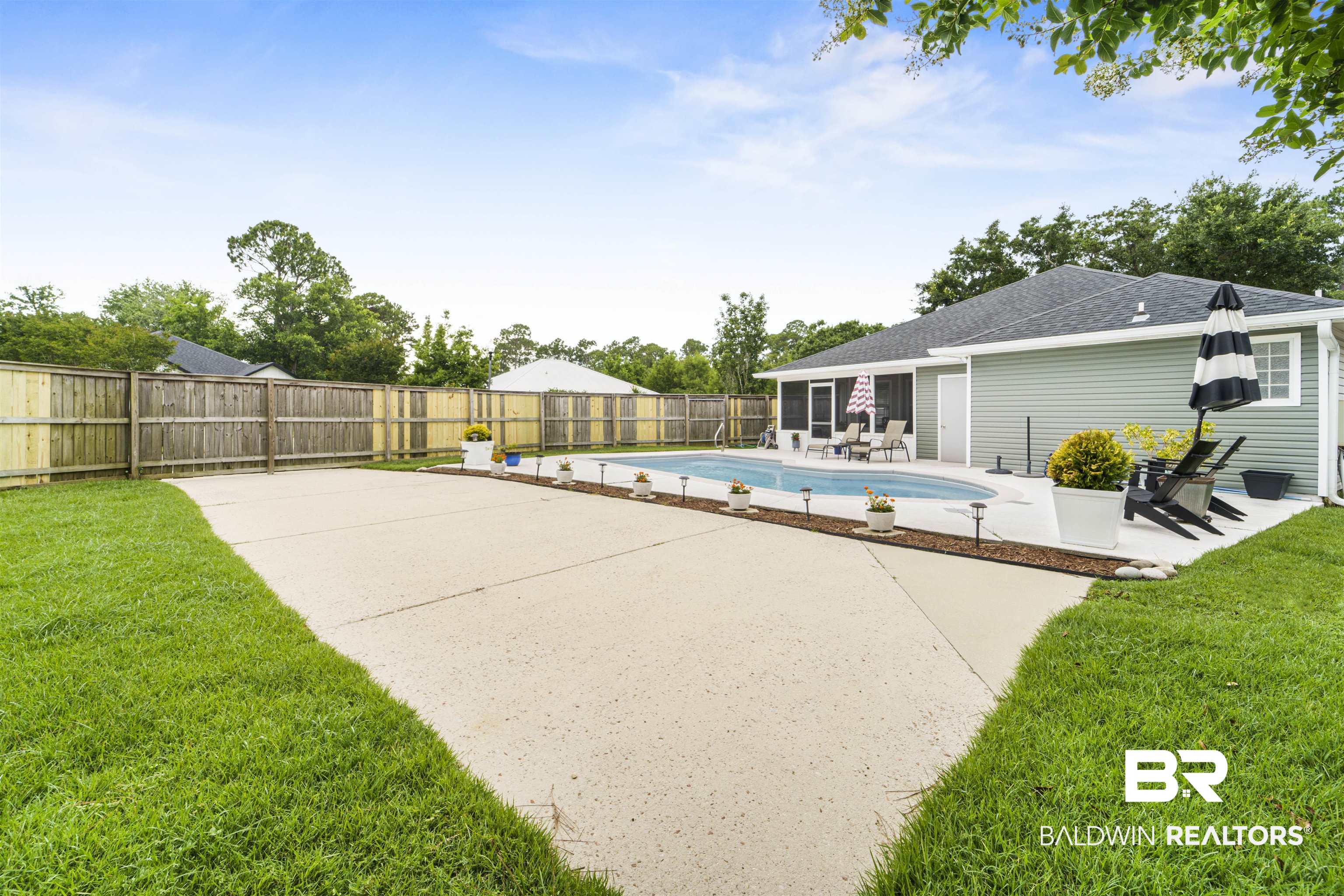 4620 Pine Boulevard Orange Beach, AL 36561 - Photo 27 of 49 View of pool with a patio and a fenced backyard