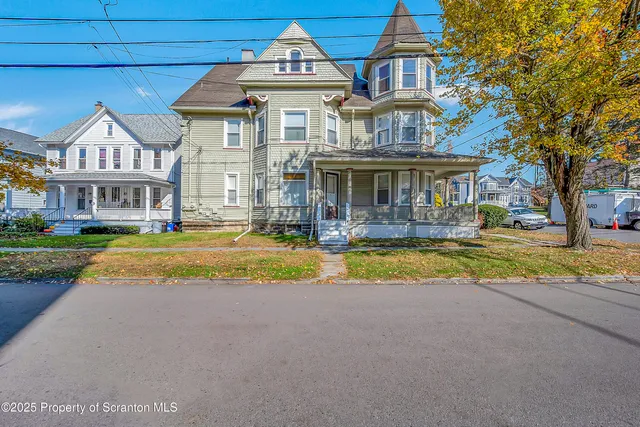 a view of a building with a yard