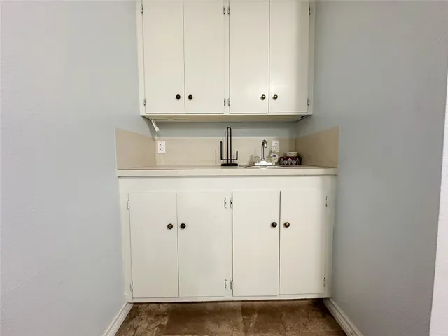 an empty room with a empty space and windows