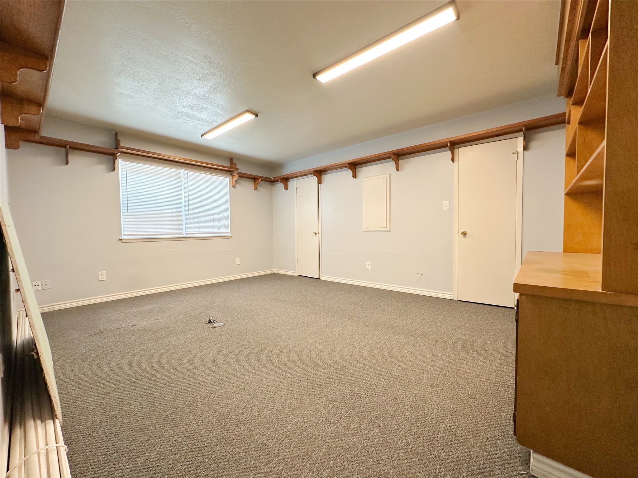 702 North Richmond Road Wharton, TX 77488 - Photo 12 of 24 an empty room with a empty space and windows