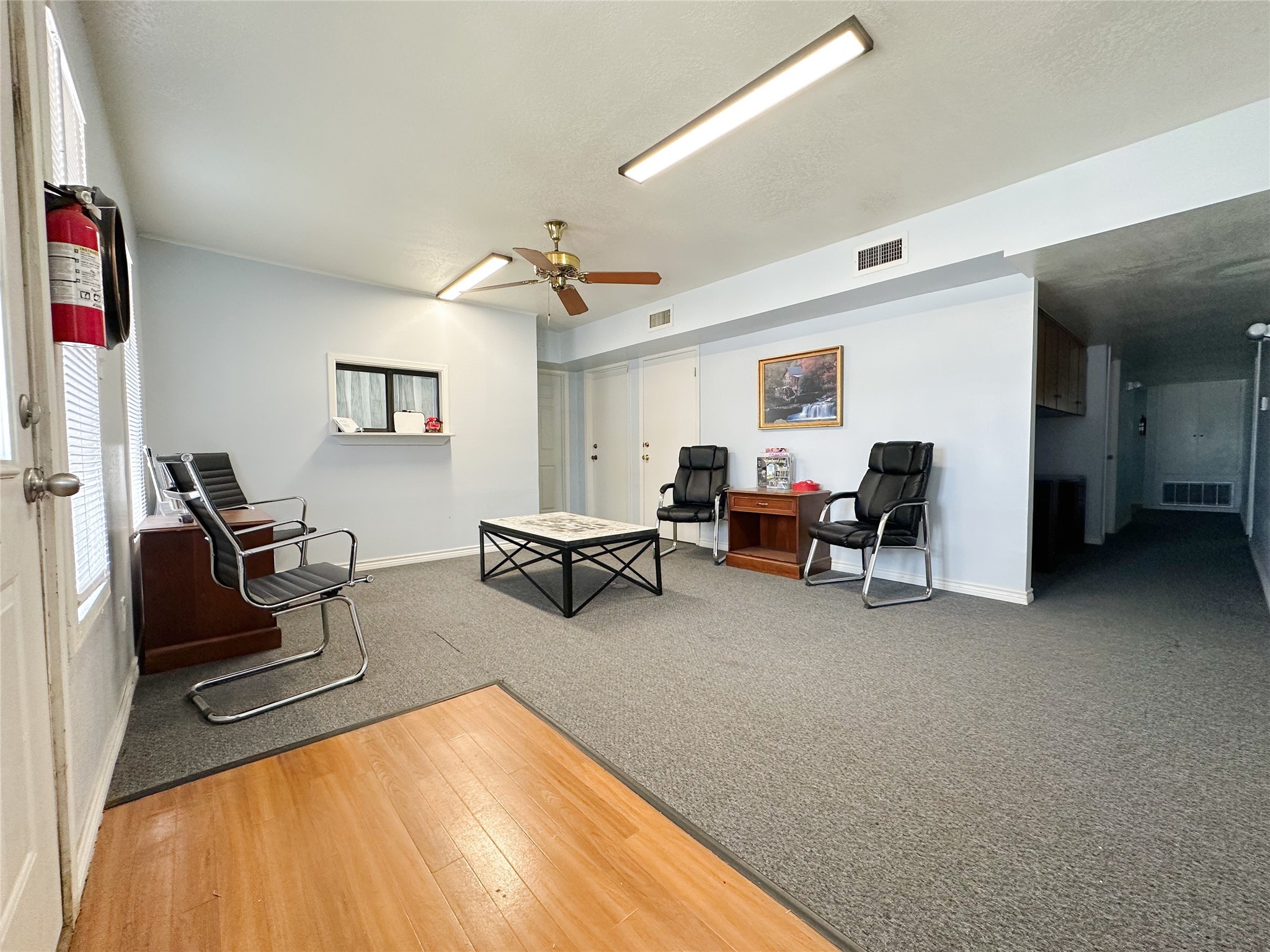 702 North Richmond Road Wharton, TX 77488 - Photo 8 of 24 a living room with furniture and a flat screen tv