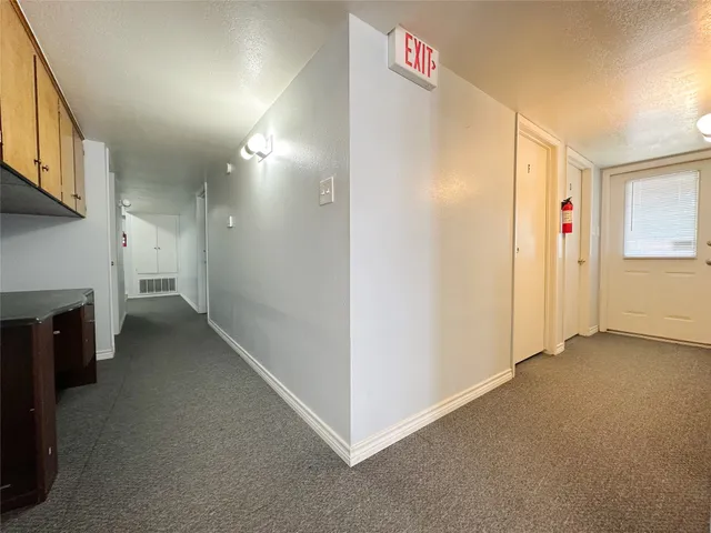 a view of work space with furniture and a window
