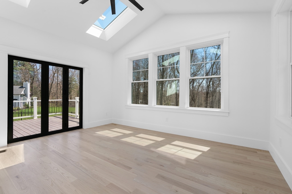 6 Sanders Lane Bolton, MA 01740 - Photo 16 of 36 a view of an empty room with a window and wooden floor