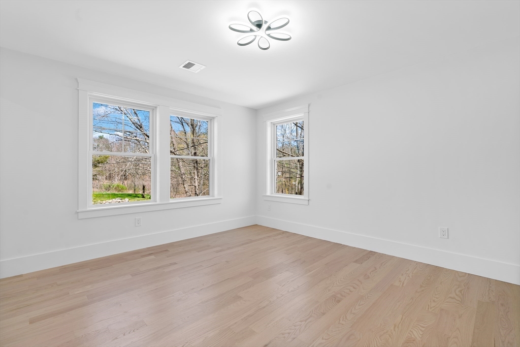 6 Sanders Lane Bolton, MA 01740 - Photo 23 of 36 a view of an empty room with a window
