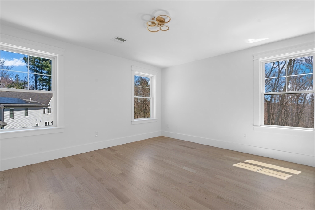 6 Sanders Lane Bolton, MA 01740 - Photo 25 of 36 wooden floor in an empty room with a window