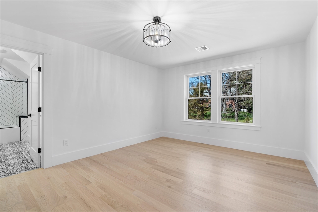 6 Sanders Lane Bolton, MA 01740 - Photo 27 of 36 a view of an empty room with a window