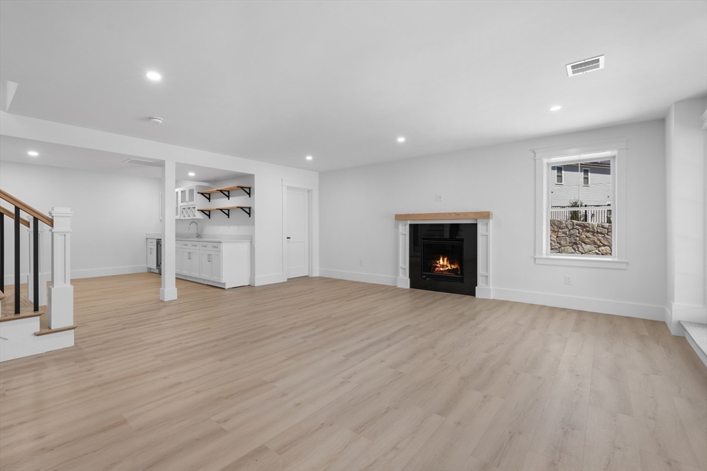 6 Sanders Lane Bolton, MA 01740 - Photo 31 of 36 a view of an empty room with a fireplace and a window