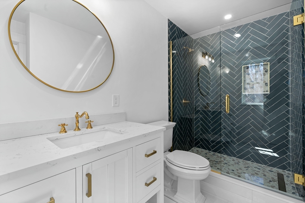 6 Sanders Lane Bolton, MA 01740 - Photo 32 of 36 a bathroom with a sink a toilet and a mirror