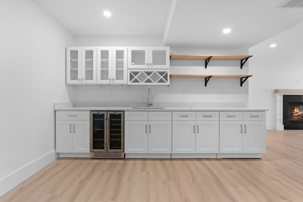 6 Sanders Lane Bolton, MA 01740 - Photo 34 of 36 a view of an empty room with a kitchen