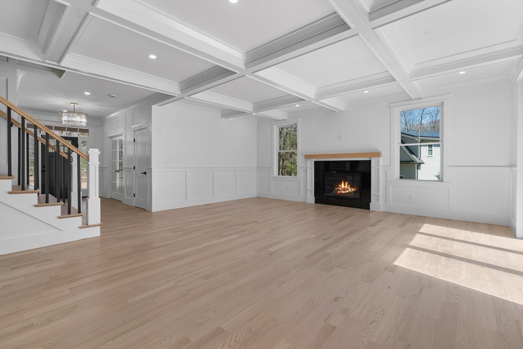 6 Sanders Lane Bolton, MA 01740 - Photo 7 of 36 a view of an empty room with a fireplace and a window