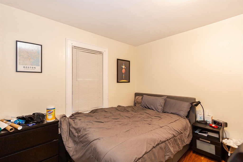 186 Calumet Street, Unit 186 Boston, MA 02120 - Photo 8 of 13 a bedroom with a bed and dresser