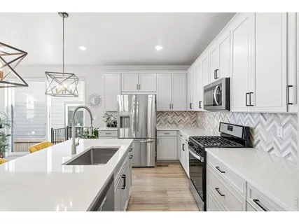 $595,000 | 8453 Gladiola Court, Unit A, Arvada, CO 80005
