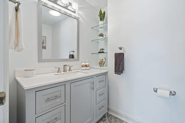 a bathroom with a sink and mirror