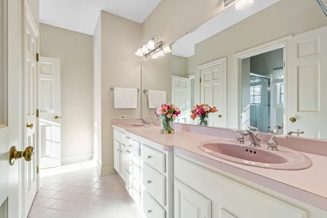 a bathroom with a granite countertop sink mirror and
