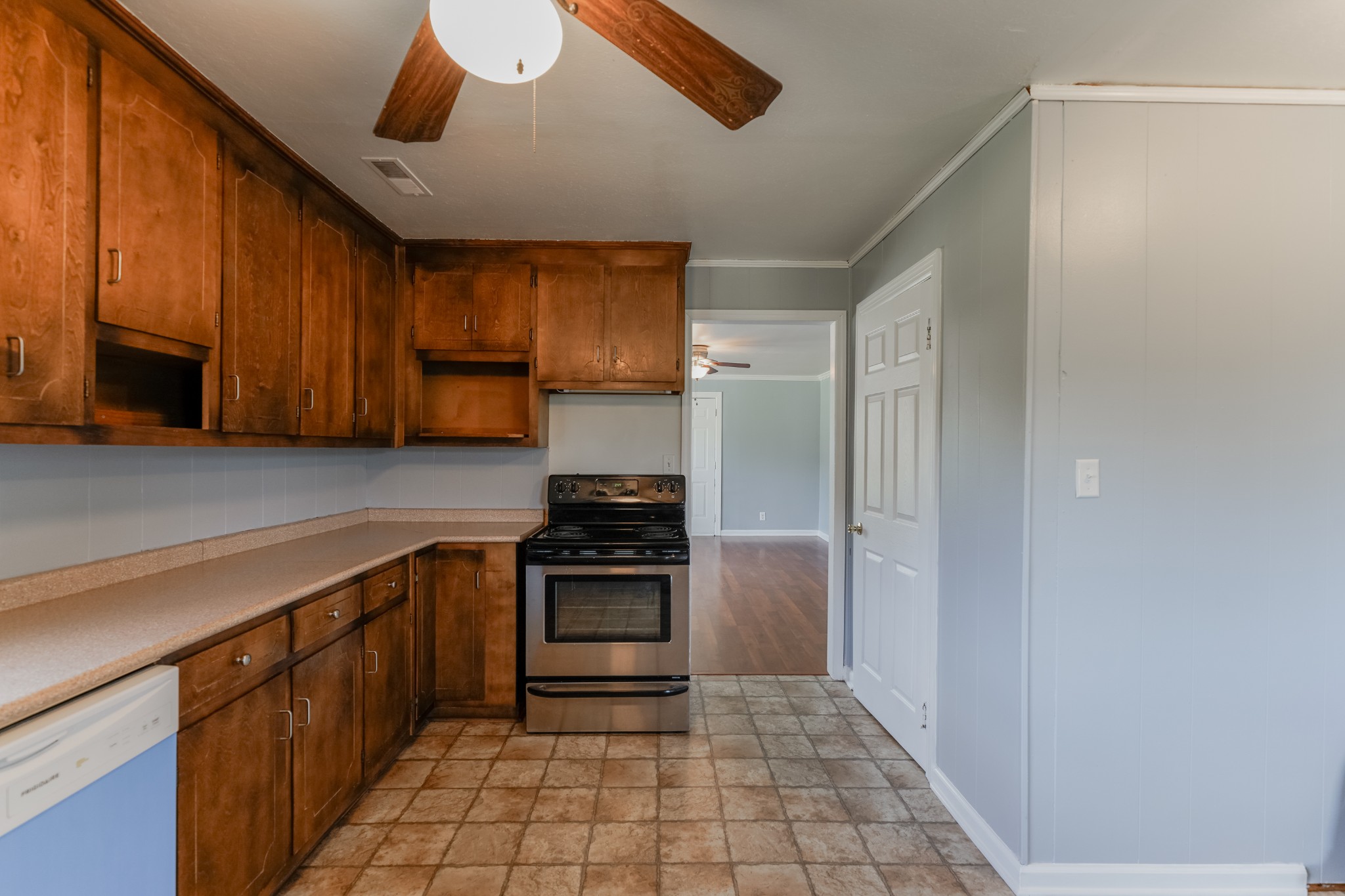 45 Bates Road Taft, TN 38488 - Photo 8 of 16 a kitchen with granite countertop a refrigerator and a stove top oven
