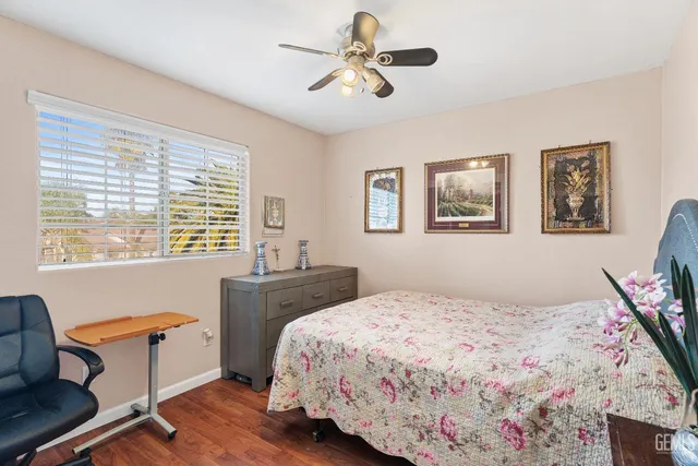 a bedroom with a bed and a dresser