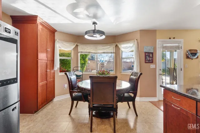 a kitchen with stainless steel appliances granite countertop a refrigerator oven a sink and dishwasher