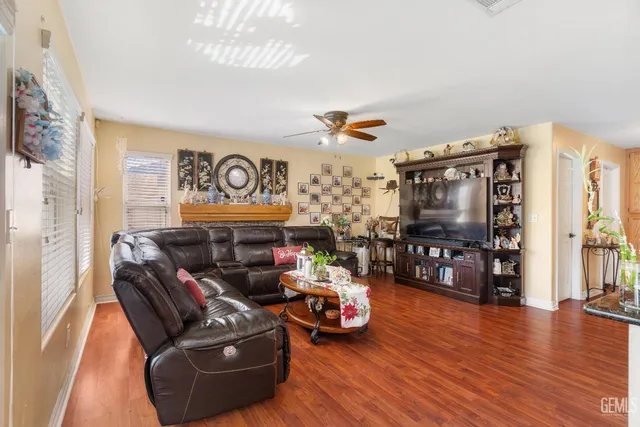 a view of a swimming pool with a yard and a porch