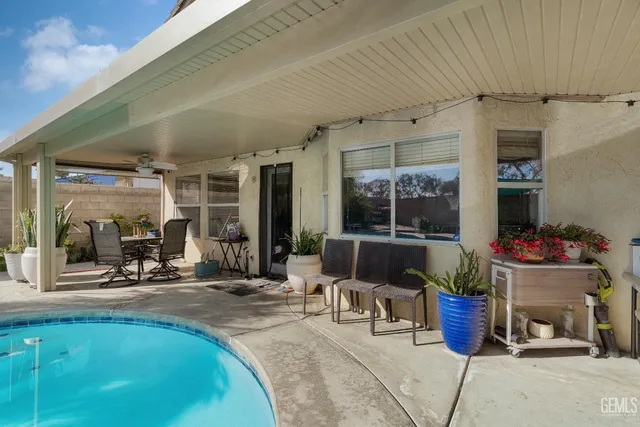 a view of a swimming pool with a yard