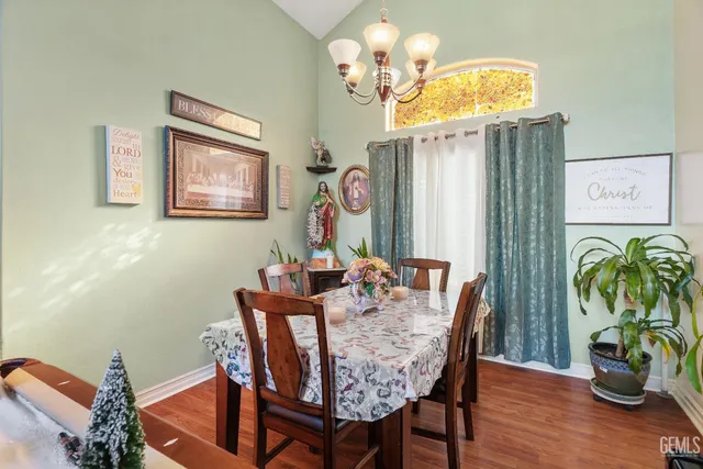 a dining room with furniture and wooden floor