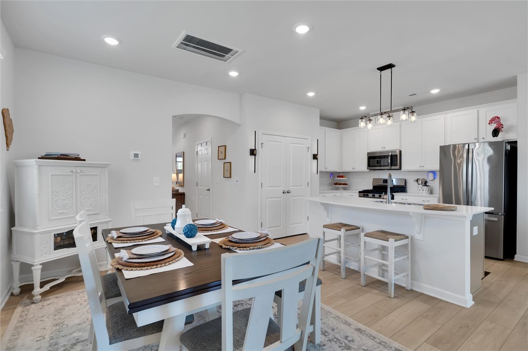 453 Bee Cv Way Pendleton, SC 29670 - Photo 3 of 25 An open concept kitchen and dining space offers effortless entertaining possibilities.