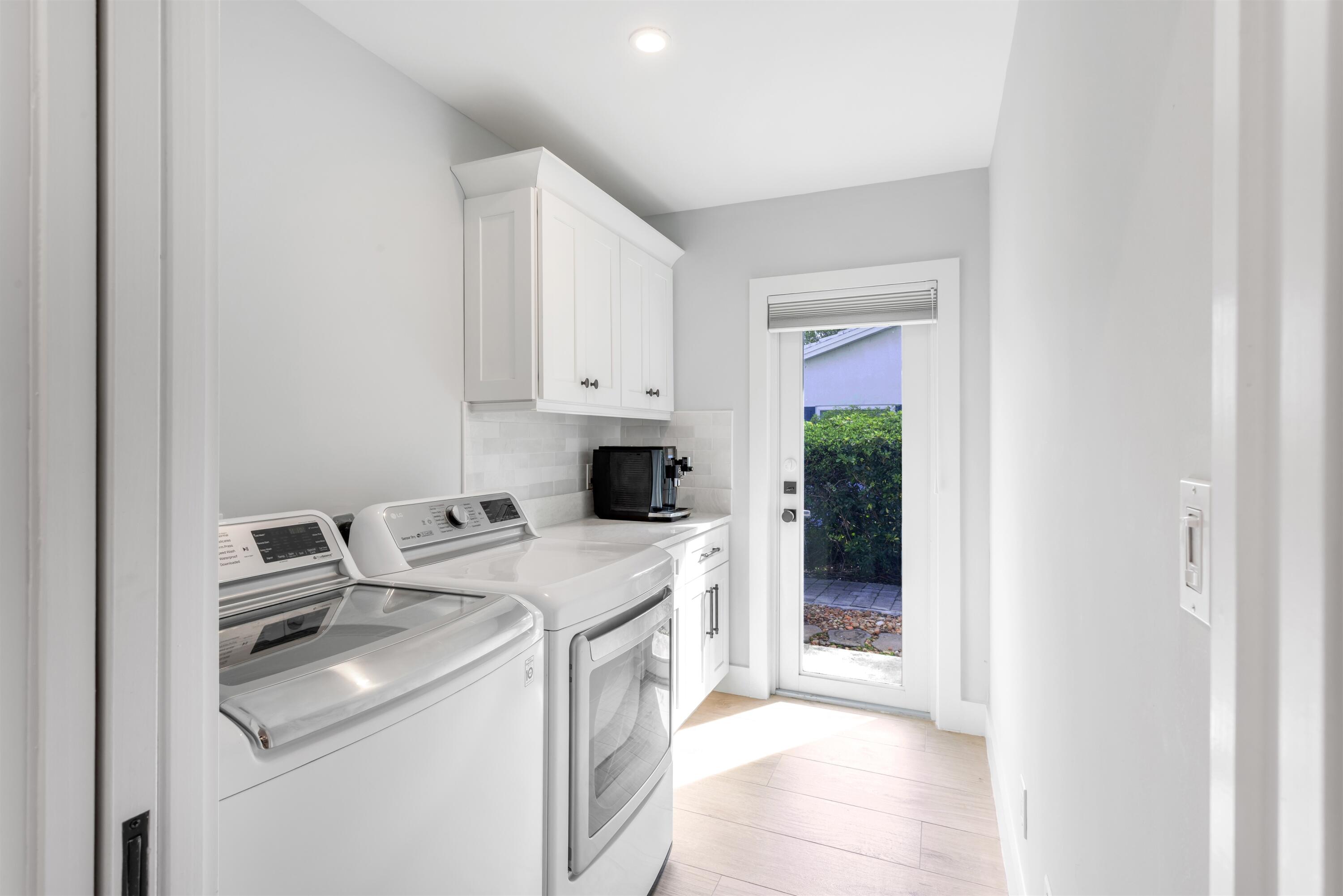 2720 Cardinal Circle Gulf Stream, FL 33483 - Photo 20 of 28 a utility room with dryer and washer
