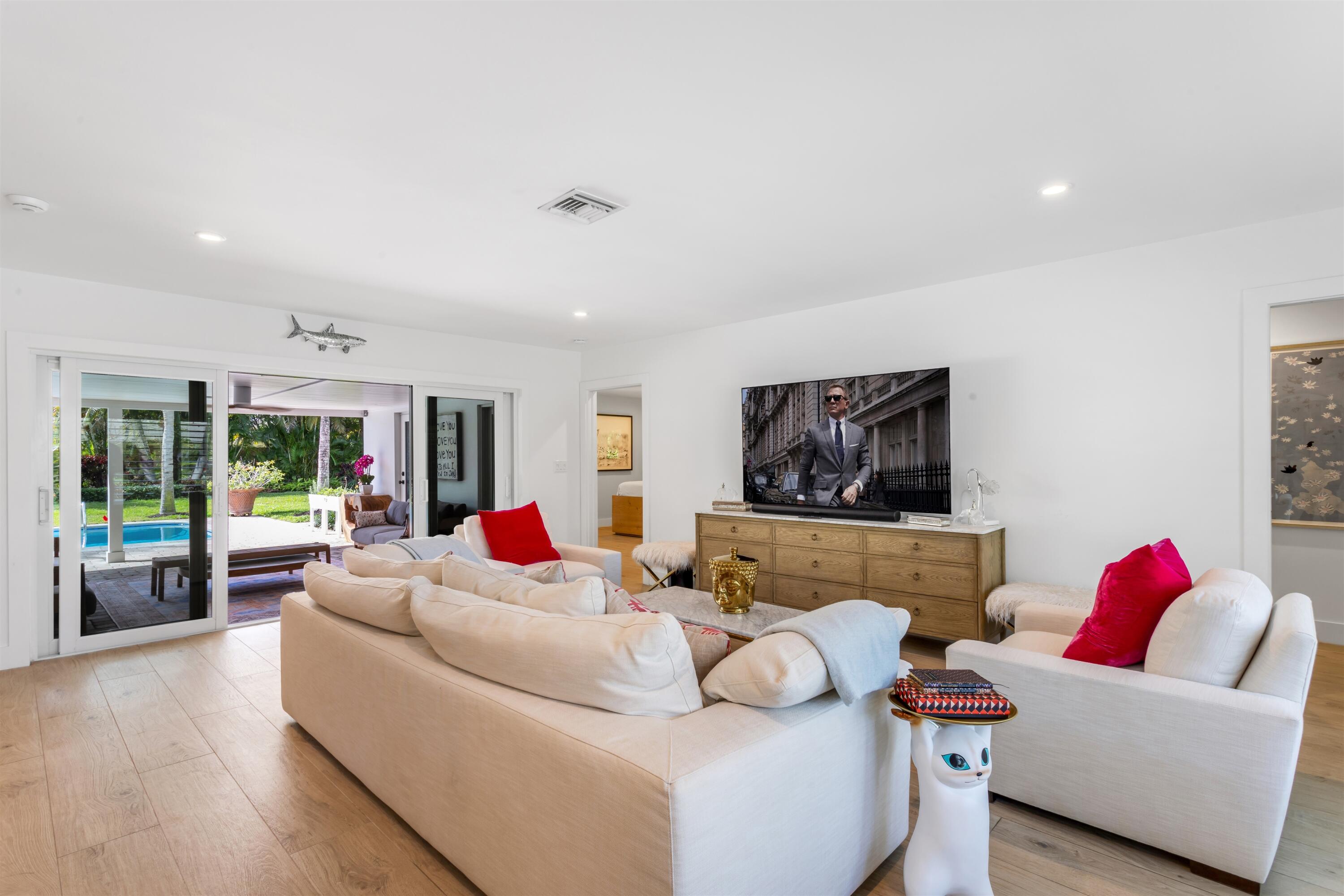 2720 Cardinal Circle Gulf Stream, FL 33483 - Photo 6 of 28 a living room with furniture and a flat screen tv