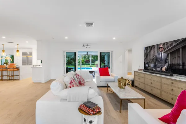 a living room with furniture and a flat screen tv