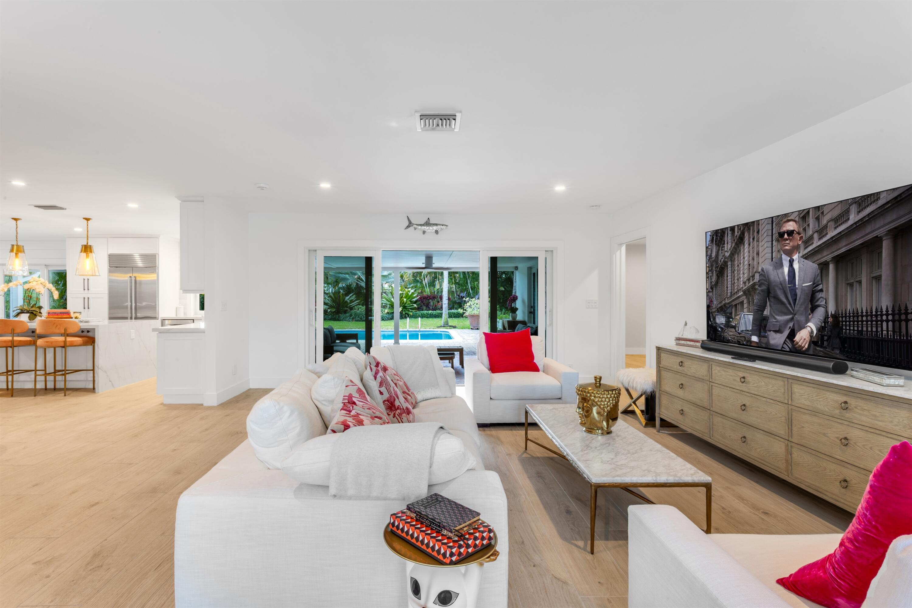 2720 Cardinal Circle Gulf Stream, FL 33483 - Photo 8 of 28 a living room with furniture and a flat screen tv