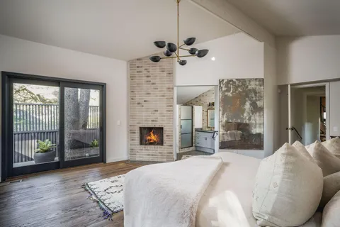 a view of a chair and tables in the balcony