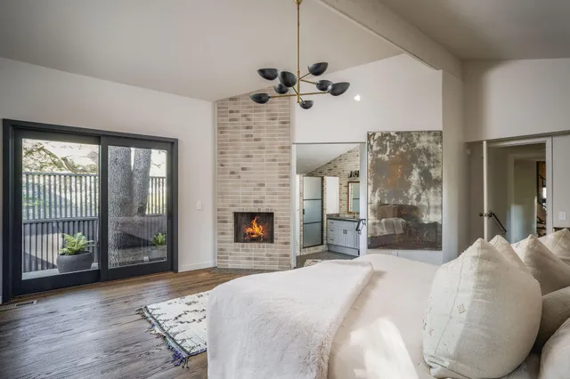 a view of a chair and tables in the balcony